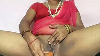 hot south indian wife inserting carrot into her pussy