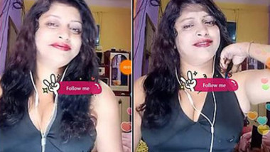 Bhabi Pegs down ,Showing big boobs cleavage in black dress