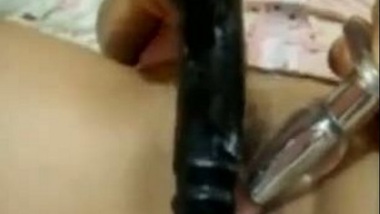 Horny housewife satisfying with dildo