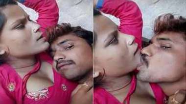 Young Desi woman is lying in bed with XXX lover kissing her on camera