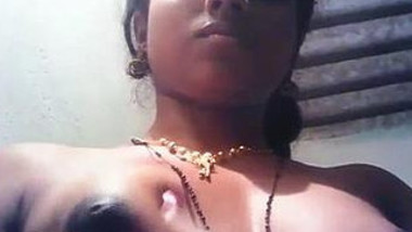Female squeezes her taut boobs for Indian viewers in close-up porn clip
