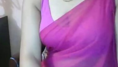 Webcam model in purple dress doesn't hurry to show Desi XXX treasures