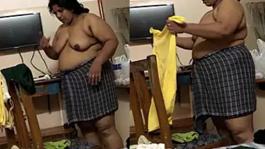 Vcvxxxxx - Fat indian woman with big belly walks around the house with naked boobs  indian tube porno