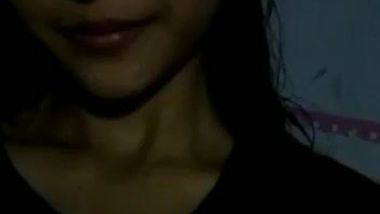 Indian films herself smiling and exposing nice boobs and dark nipples