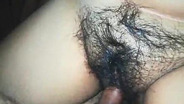 Indian man nails wife's hairy XXX muff during sex in darkened bedroom