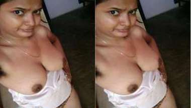 Female is Desi and feels free to perform XXX show of her breasts