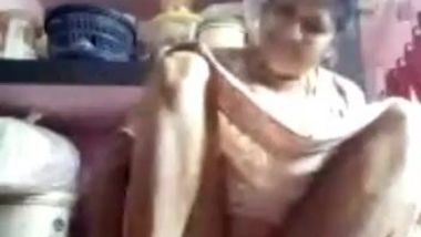 Arousing Desi mom sits on floor and denudes snatch under the dress