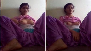 Horny Indian teen can masturbate without taking off a purple outfit