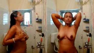 Desi whore lays bare XXX tits with dark nipples in the shower cabin