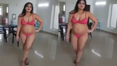 Seductive Indian woman in red lingerie looks like a porn actress