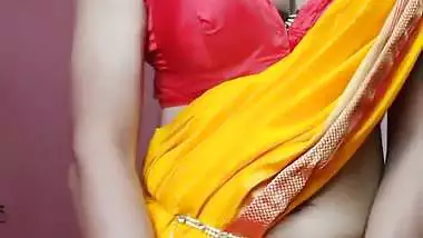 Indian shemale enjoys strip teasing and masturbating