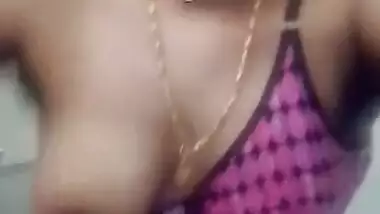Attractive Indian woman with glasses shows XXX assets in bathroom