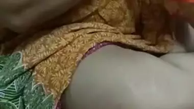 Indian MILF enjoys embroidering with a breast out in homemade porn clip