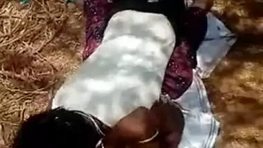 Guy lies on top of Desi girlfriend in front of XXX cameraman outdoors