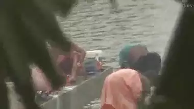 Indian women bathing by the river