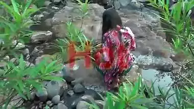Young girl bathing in jungle showing hot bareback and cleavage