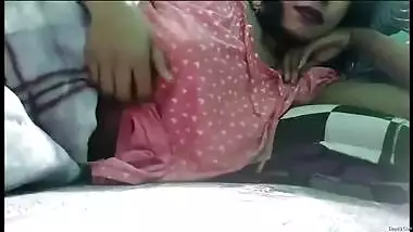 Young Indian woman pulls T-shirt up and bra uncovering XXX tits