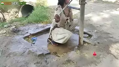 Young village school girl taking a bath in a sari and caught on camera