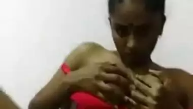 Sexy Indian girl pulls sex red lingerie down to flash her XXX titties