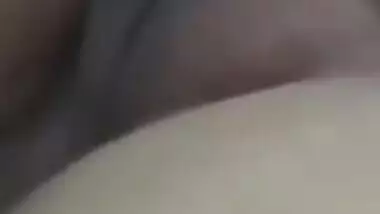 Relaxed Desi aunty lies on the bed with her sweet XXX vagina exposed