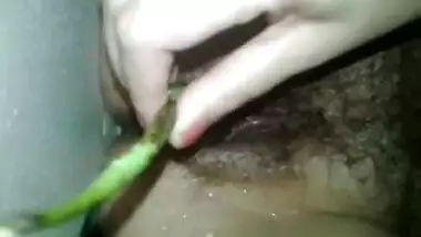 Hot Indian wife Binitha taking veggie in her pussy