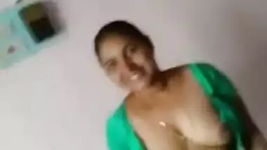 Boy is lying in bed filming Desi slut who bares her XXX tits for him