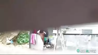 Neighbor on a hidden camera caught aunt taking a bath on the outdoor naked