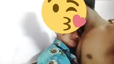 Desi girl in floral shirt kisses porn partner being covered with a smile