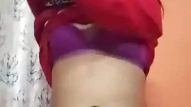 An 18-year-old desi nude girl strips and fingers her pussy