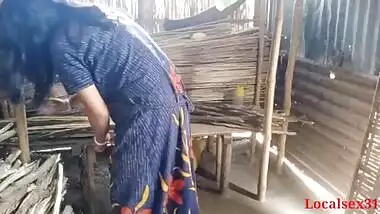 Bihari babu pounds his malkin outdoors in a hut