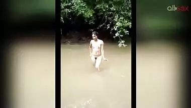 Fuckable Desi aunty bathes outdoor and shows off her hairy pussy