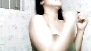 Pantyless Desi girl enjoying shower dance on cam