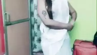 Desi girl in transparent sari dances and sings in short TikTok video