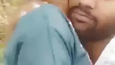 Indian outdoor sex of a guy sucking his GF’s tight boobs